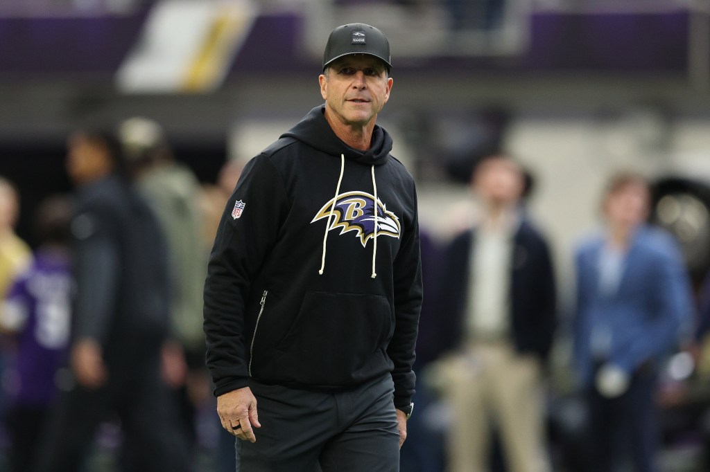 Baltimore Ravens head coach John Harbaugh on the field.