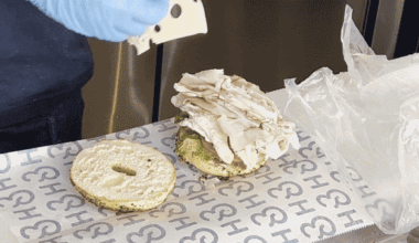 A GIF showing an H&H Bagel sandwich being made.