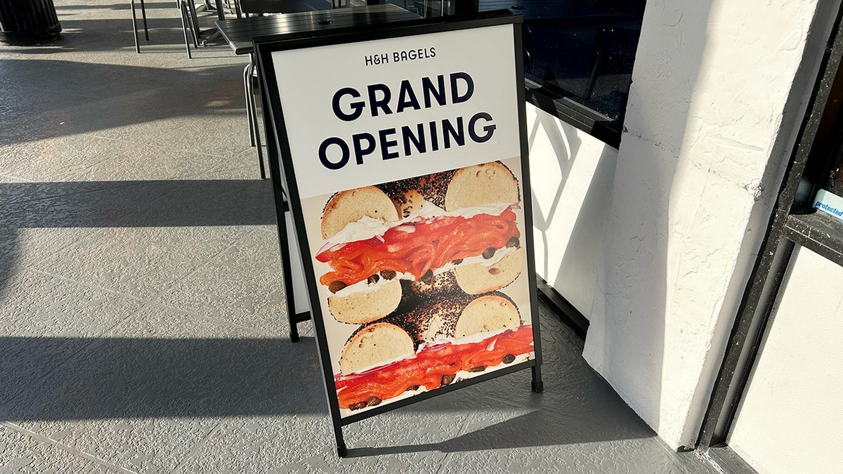 A grand opening sign for H&H Bagels in Boca Raton, Florida.