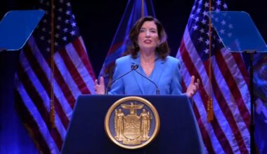 governor kathy hochul speaks from a podium