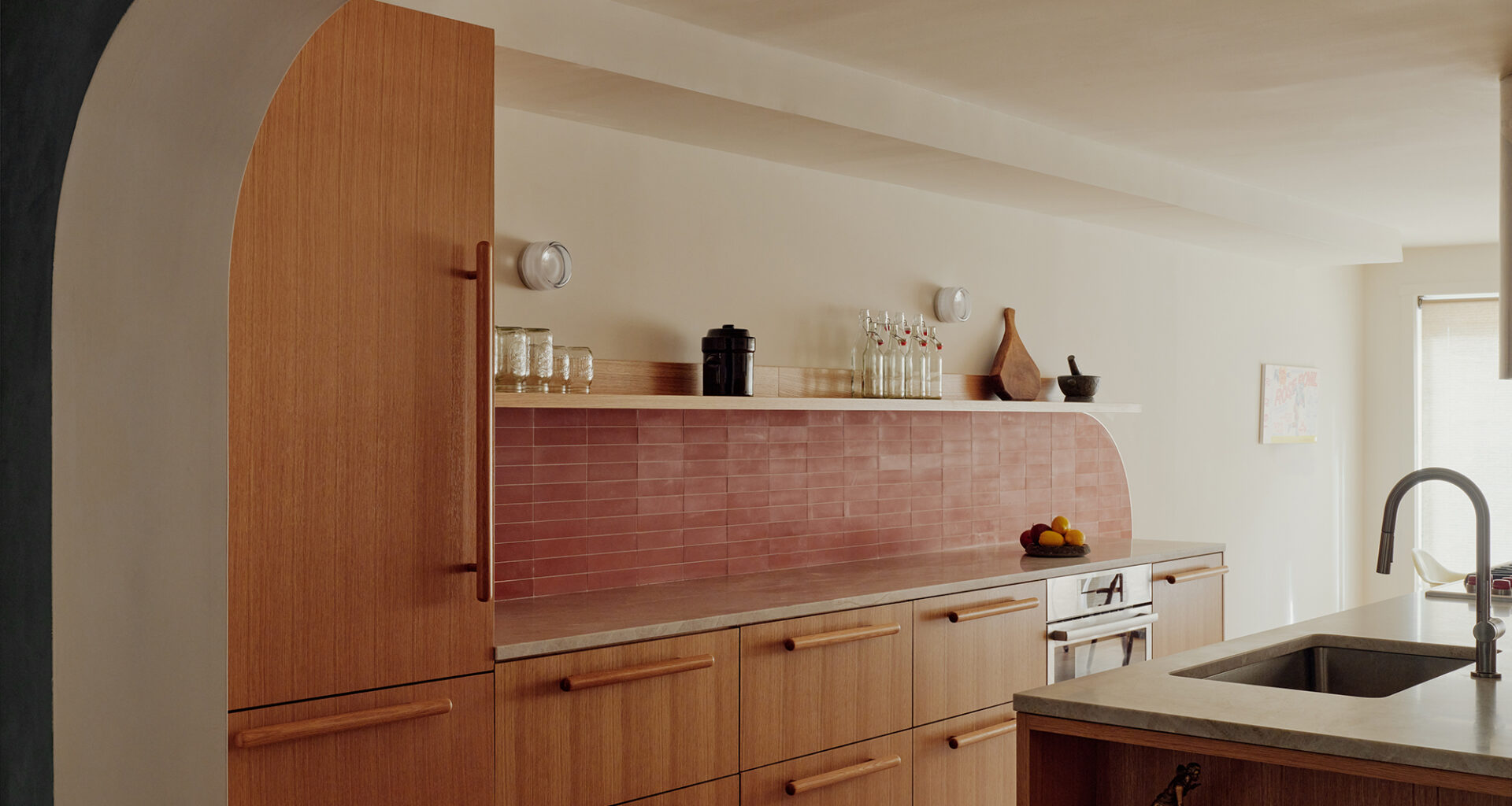 KITCHEN WALL OF WOOD CABINETS RED TILE WORK WITH CURVE
