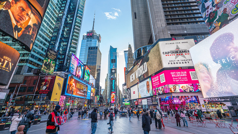 NYC's Times Square is filled with bright lights and crowds.