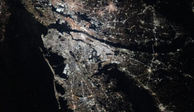 The New York–Newark–Jersey City Metropolitan Area at night. City lights illuminate most of the image.