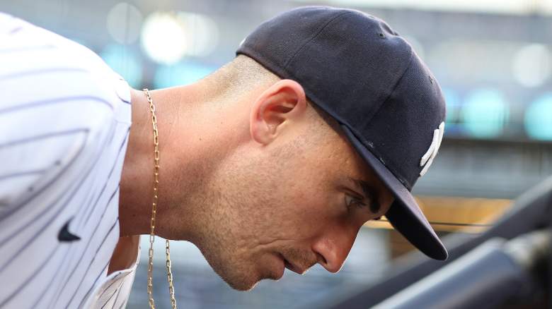 New York Yankees player Cody Bellinger looks down during a game.