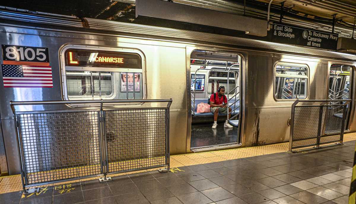 an MTA subway train with its doors open in a station