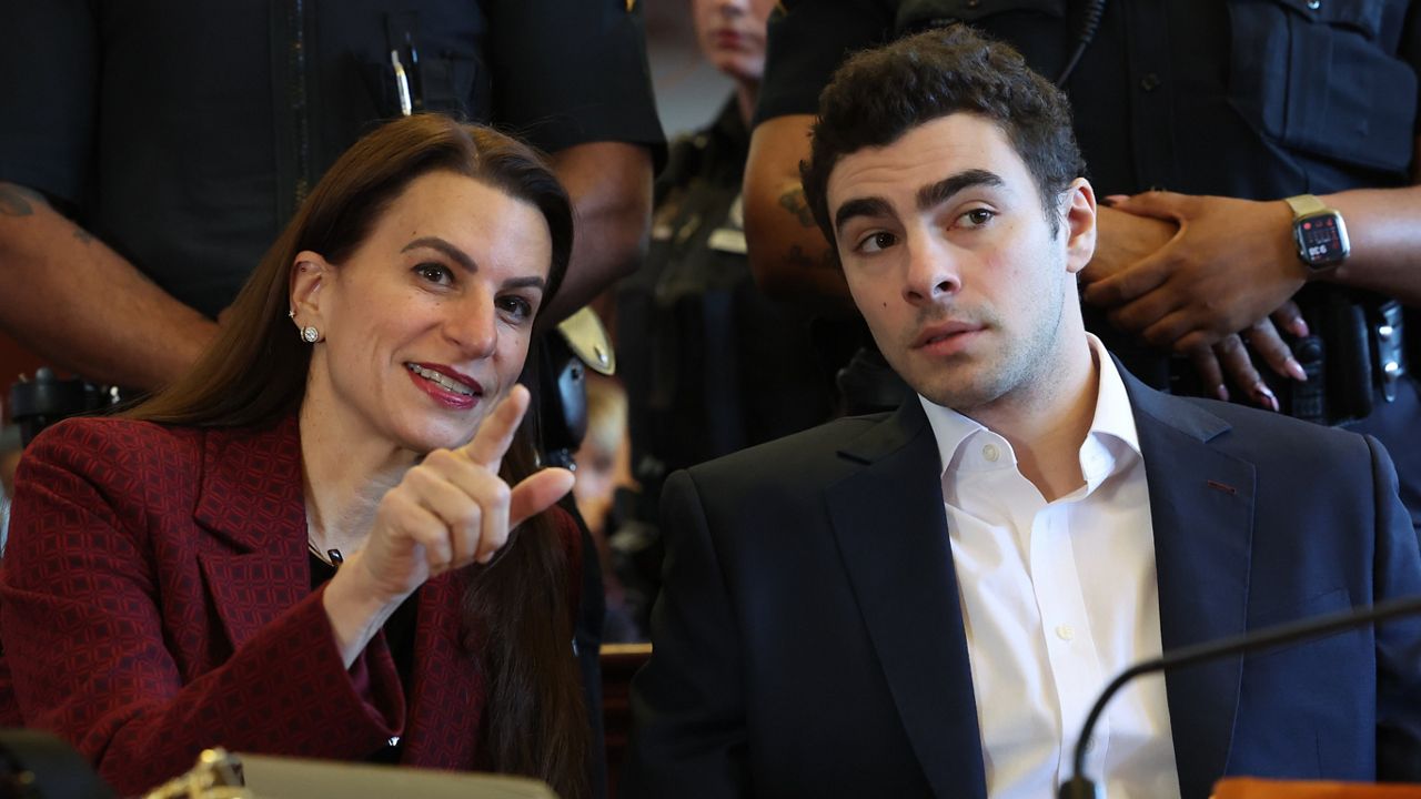 Luigi Mangione appears in Manhattan Criminal Court for an evidence hearing on Friday, Dec. 12, 2025. (William Farrington /New York Post via AP, Pool)