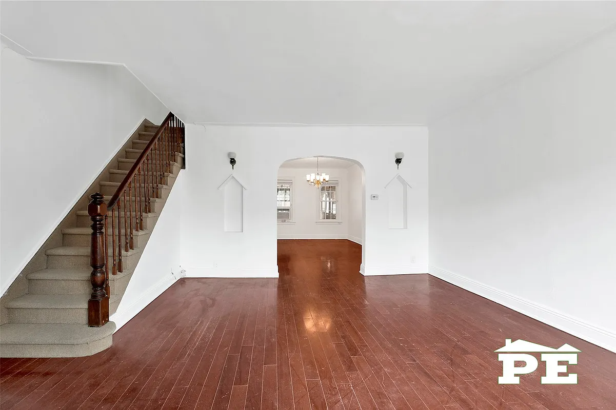 living room with white walls, niches