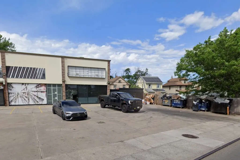 The adult man was discovered minutes before 7 a.m. inside the flaming receptacle in front of the Conduit Plaza strip on North Conduit Avenue near Springfield Boulevard in Springfield Gardens, police said. 