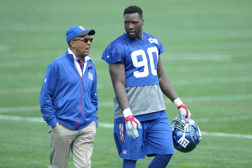 Jason Pierre-Paul (90) of the New York Giants with Ronnie Barnes during practice at minicamp.