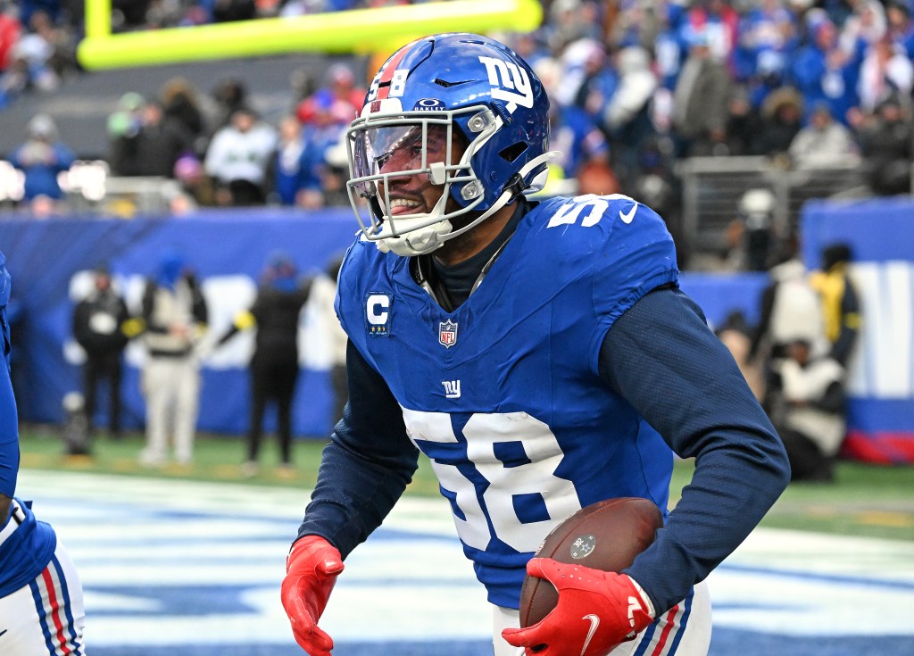 New York Giants linebacker Bobby Okereke (58) is all smiles as he celebrates after he intercepts the ball during the fourth quarter of the Giants and Dallas Cowboys game in East Rutherford, NJ.