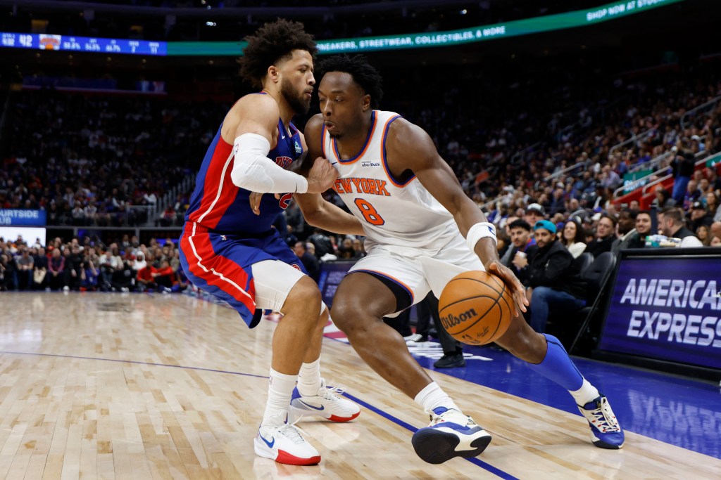 New York Knicks forward Og Anunoby (8) dribbles defended by Detroit Pistons guard Cade Cunningham (2) in the first half at Little Caesars Arena. 