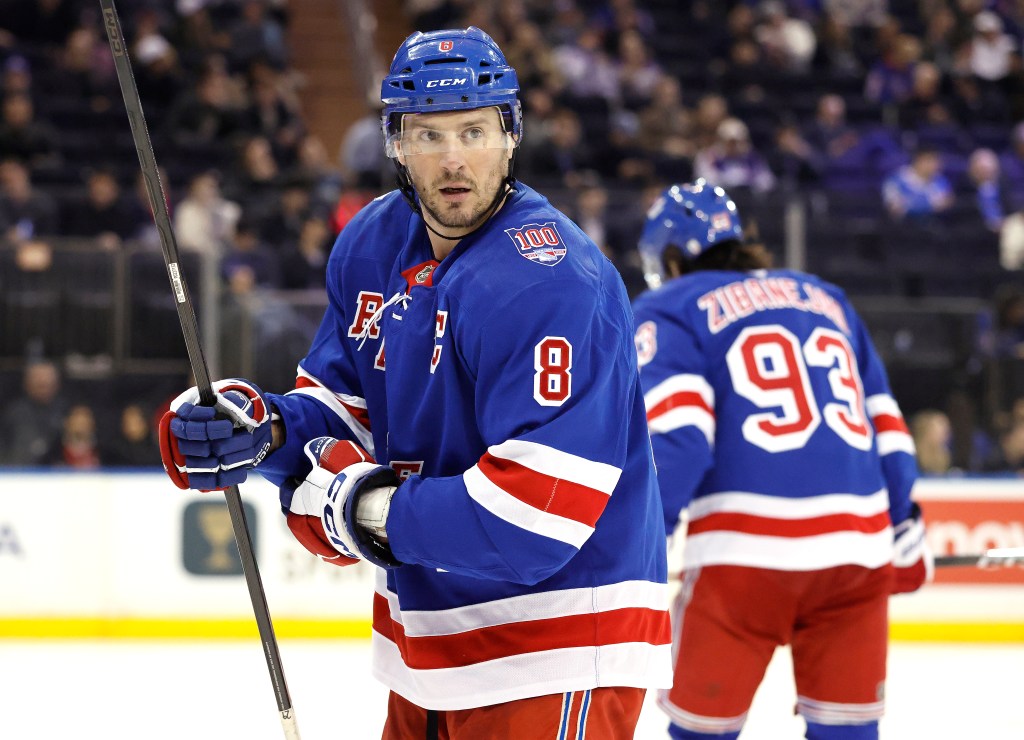 New York Rangers center J.T. Miller wearing a blue jersey with number 8 on the ice.