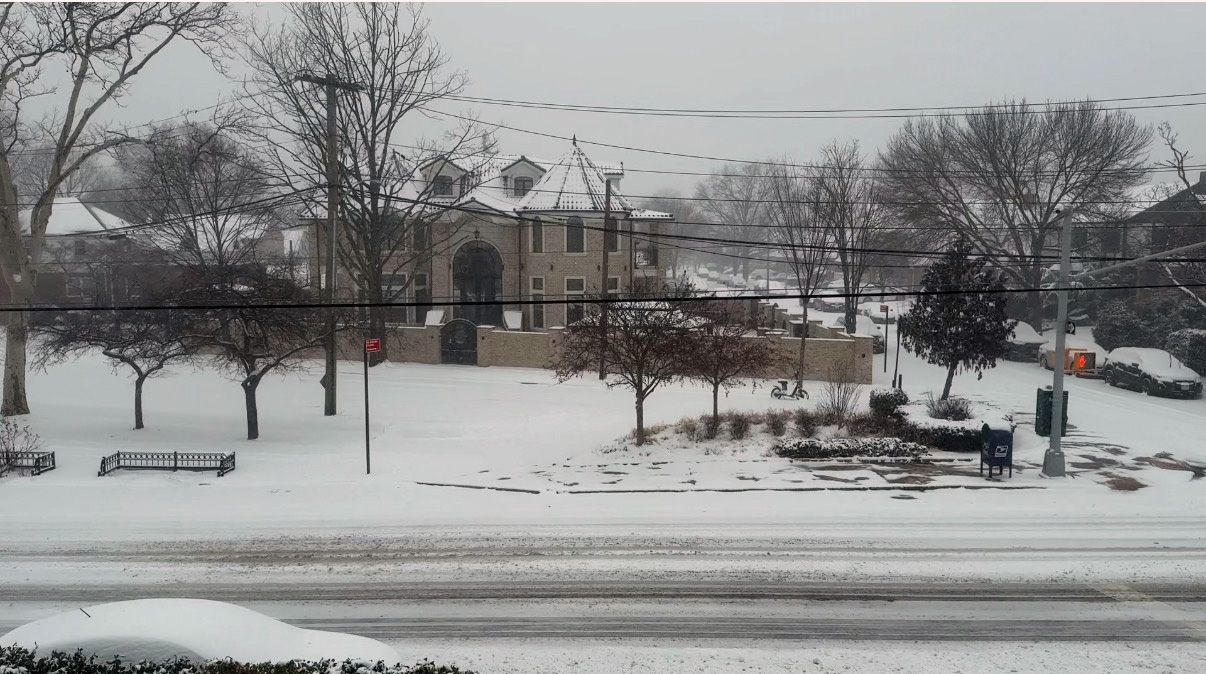 A photo of snow in Fresh Meadows, Queens Sunday morning.