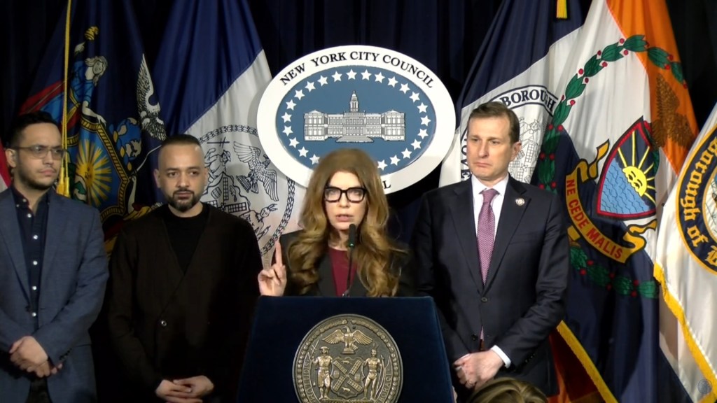 Speaker Julie Menin (C) of the New York City Council speaking at a press conference.
