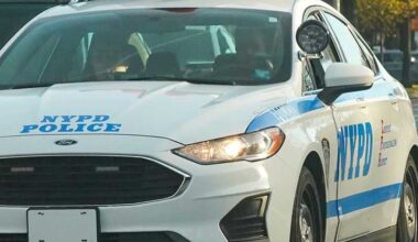 NYPD police car with lights on