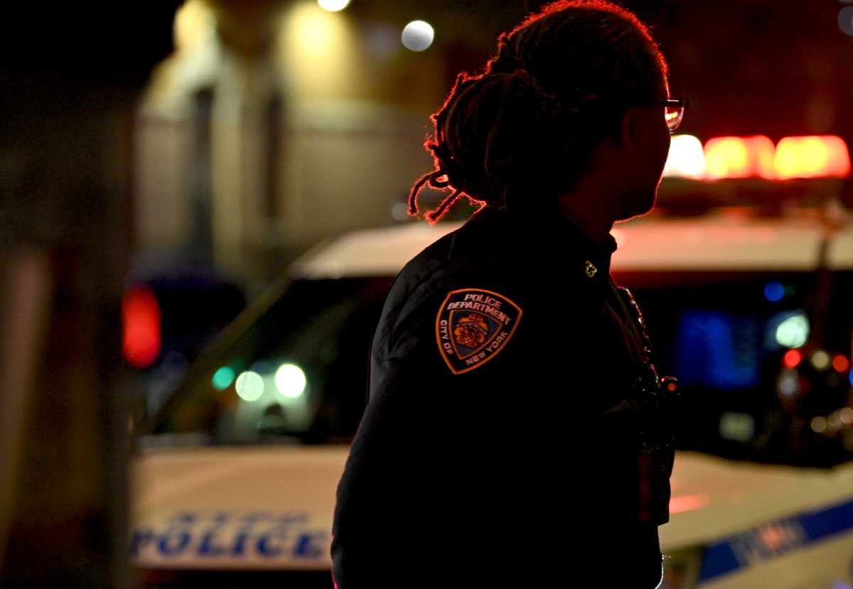 A police officer at a Midtown shooting scene