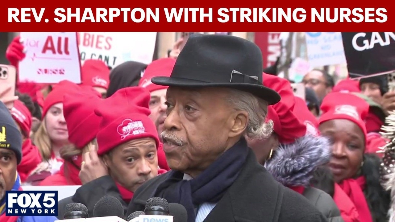 Rev. Al Sharpton speaks with striking nurses