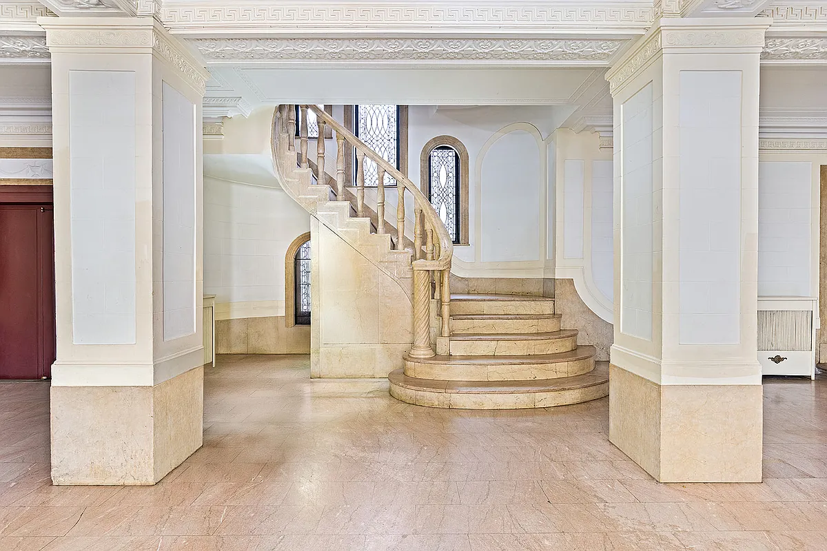 lobby with plasterwork, stone staircase