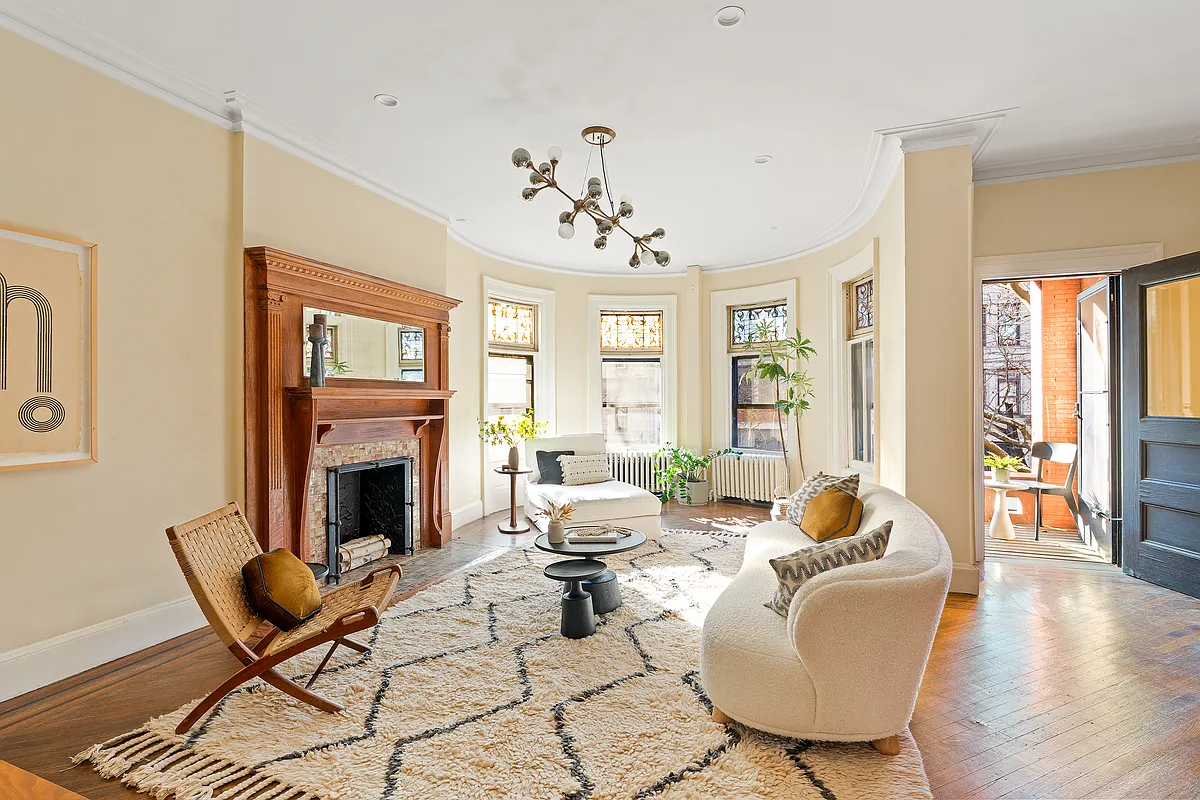 Parlor with wood mantel, stained glass
