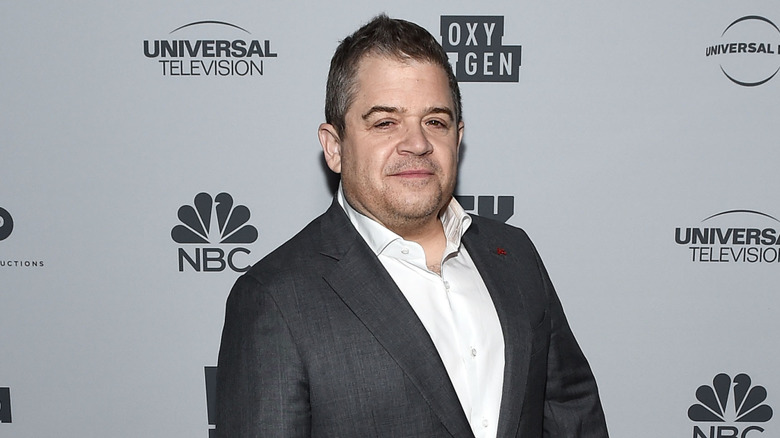 Patton Oswalt smiling at NBC Universals Press junket in 2017