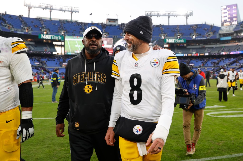 Pittsburgh Steelers head coach Mike Tomlin and quarterback Aaron Rodgers (8) walk off the field after the game against the Baltimore Ravens.