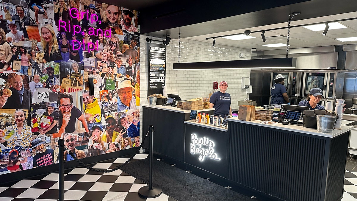Employees are seen inside a PopUp Bagels in Delray Beach, Florida.