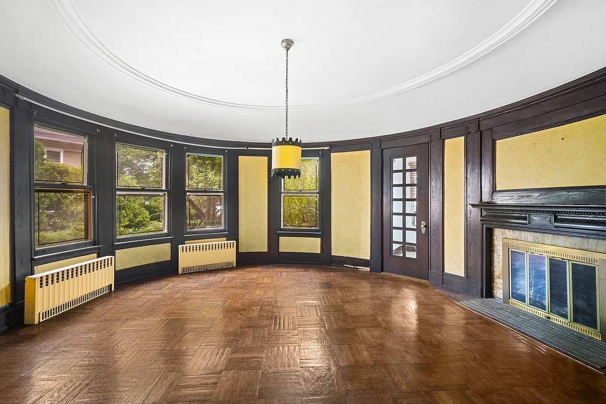 oval dining room with mantel