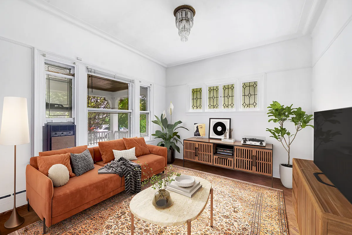 small parlor virtually staged with sofa and sideboards