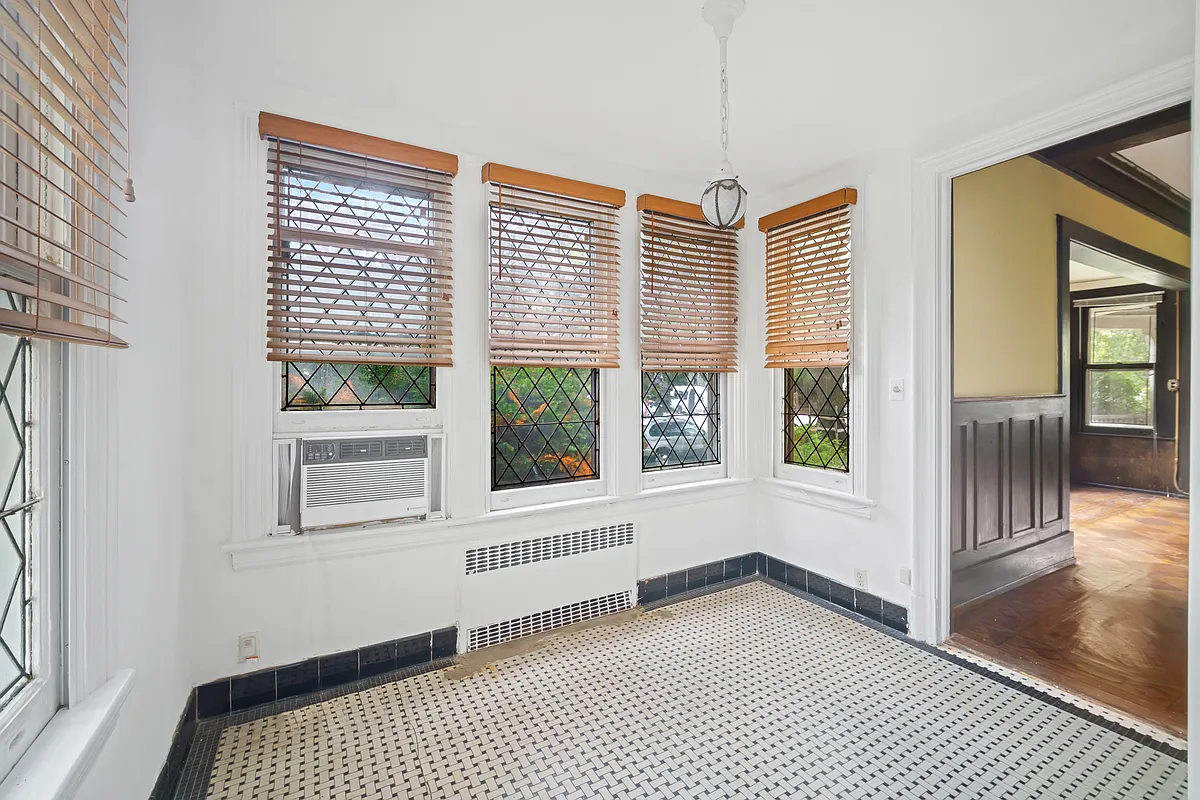 small sun room with mosaic tile floor