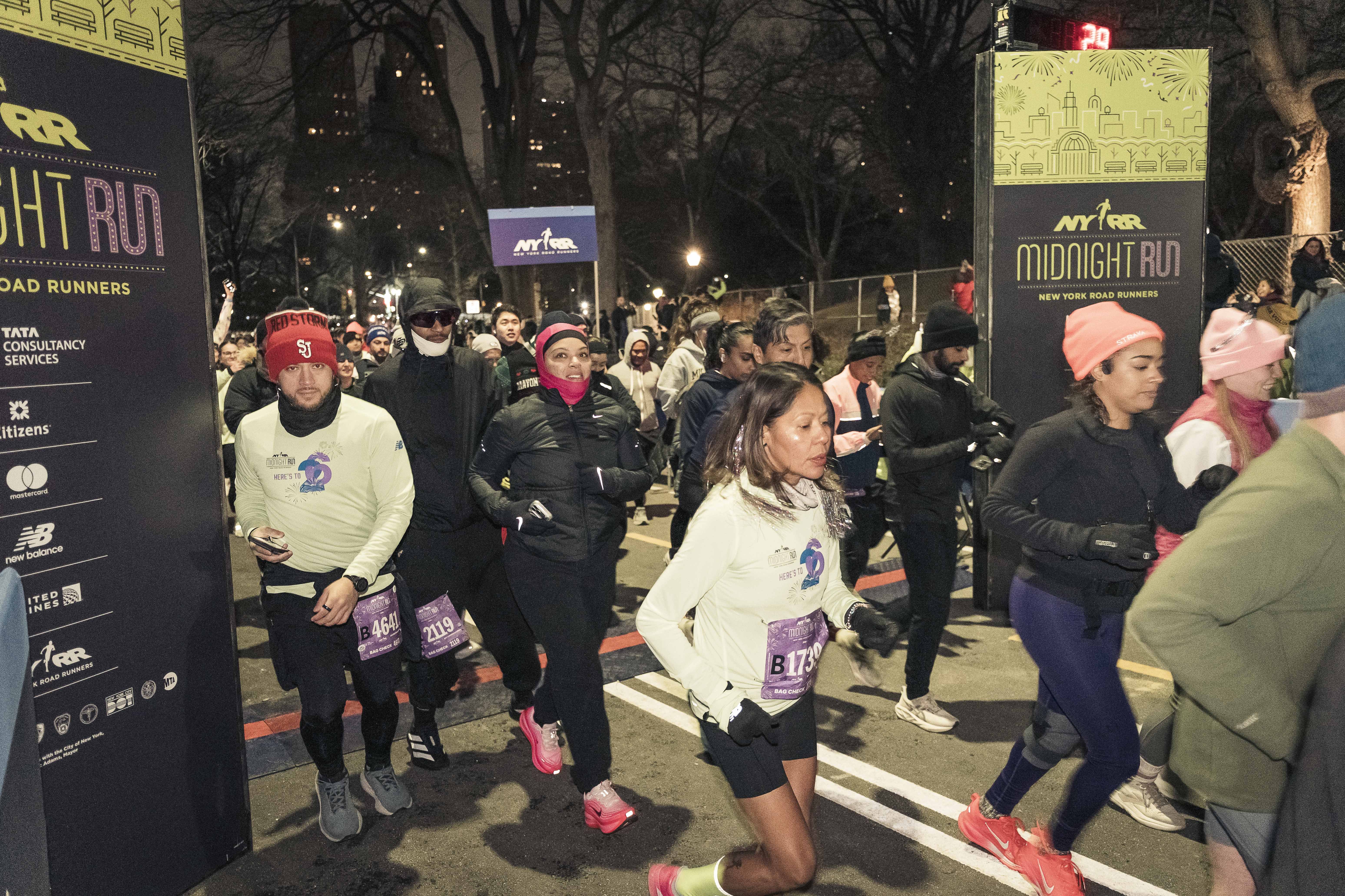 At the stroke of midnight, runners begin the 4-mile race in Central Park.