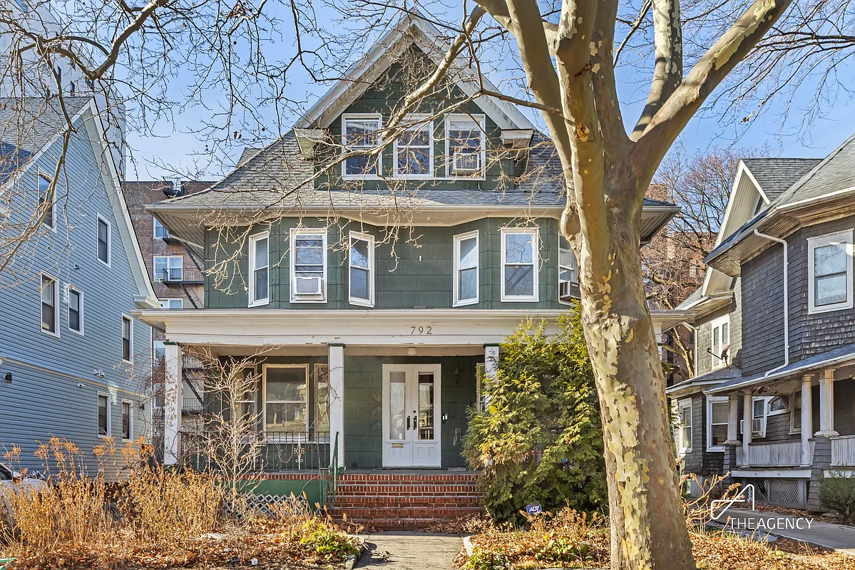 standalone house with green siding