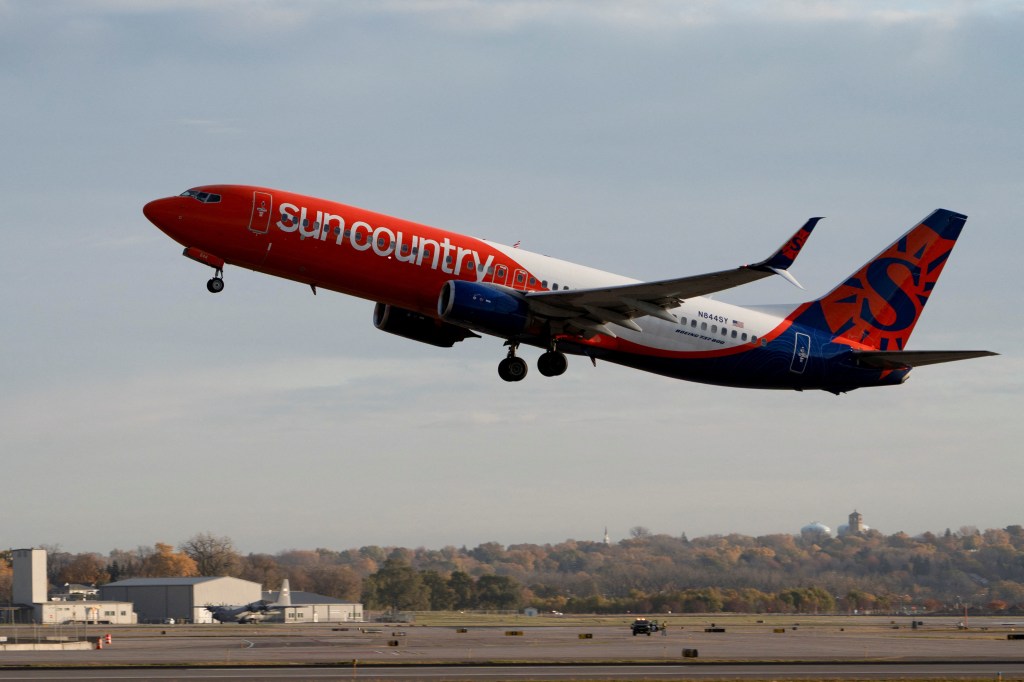 A Sun Country Airlines plane takes off from Minneapolis–Saint Paul International Airport.