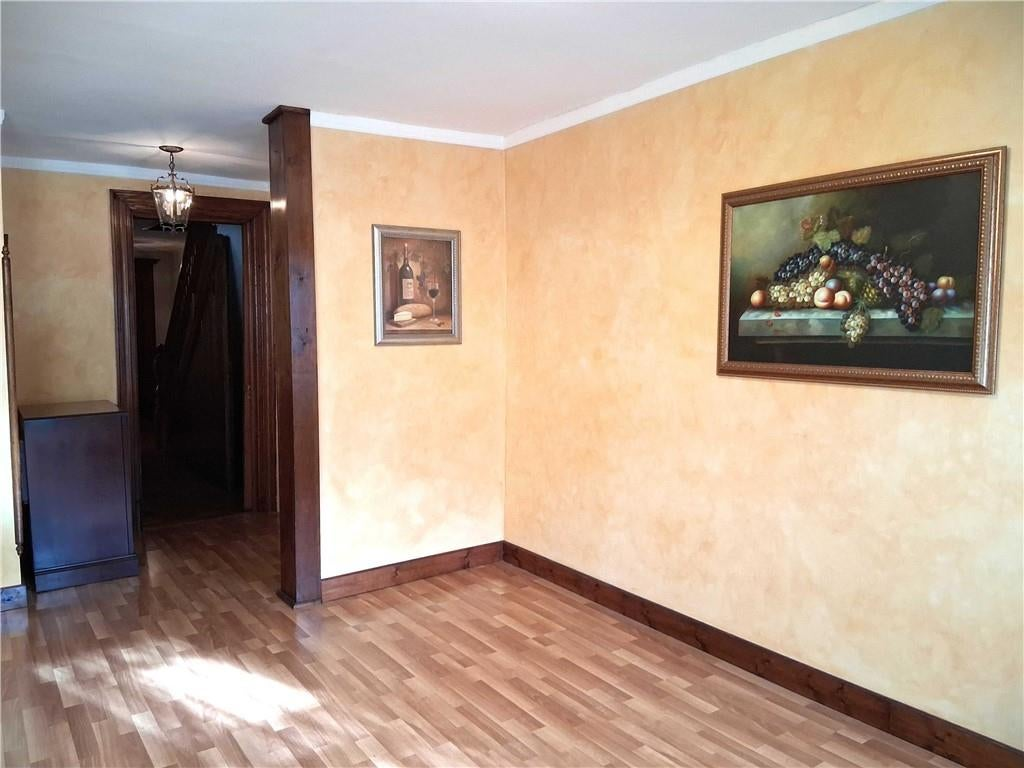 dining area off kitchen with yellow walls