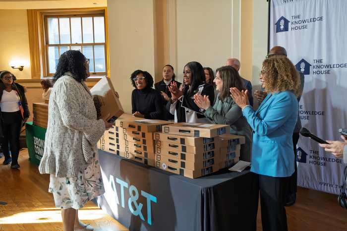 Jerelyn Rodriguez Williams is joined by Bronx Borough President Vanessa L. Gibson, during a computer giveaway program hosted by the organization at the Bronx Community College.