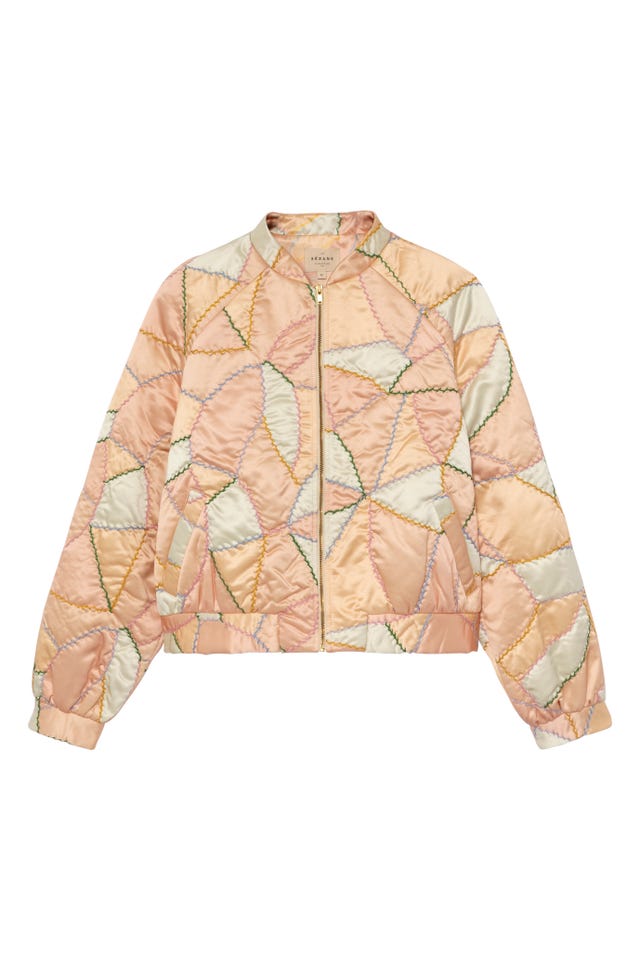 quilted bomber jacket in pastel colors with geometric stitching