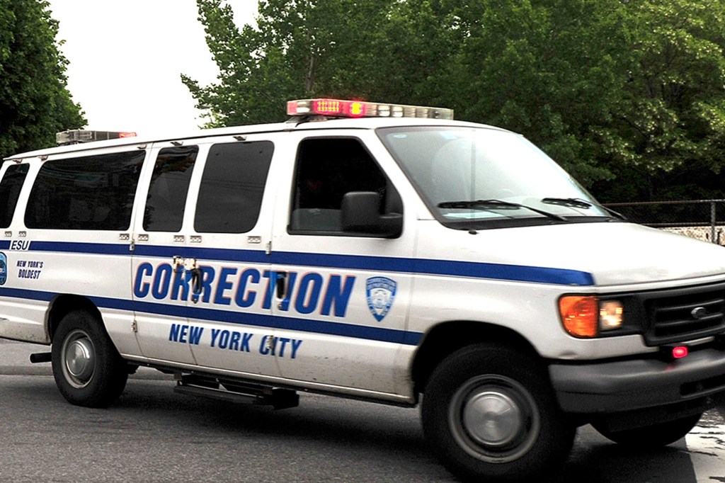 NEW YORK, NY - MAY 20: A view of two New York City Corrections Department vans exiting Rikers Island with their sirens on possibly holding the former IMF Director Dominique Strauss-Kahn on May 20, 2011 in New York City.