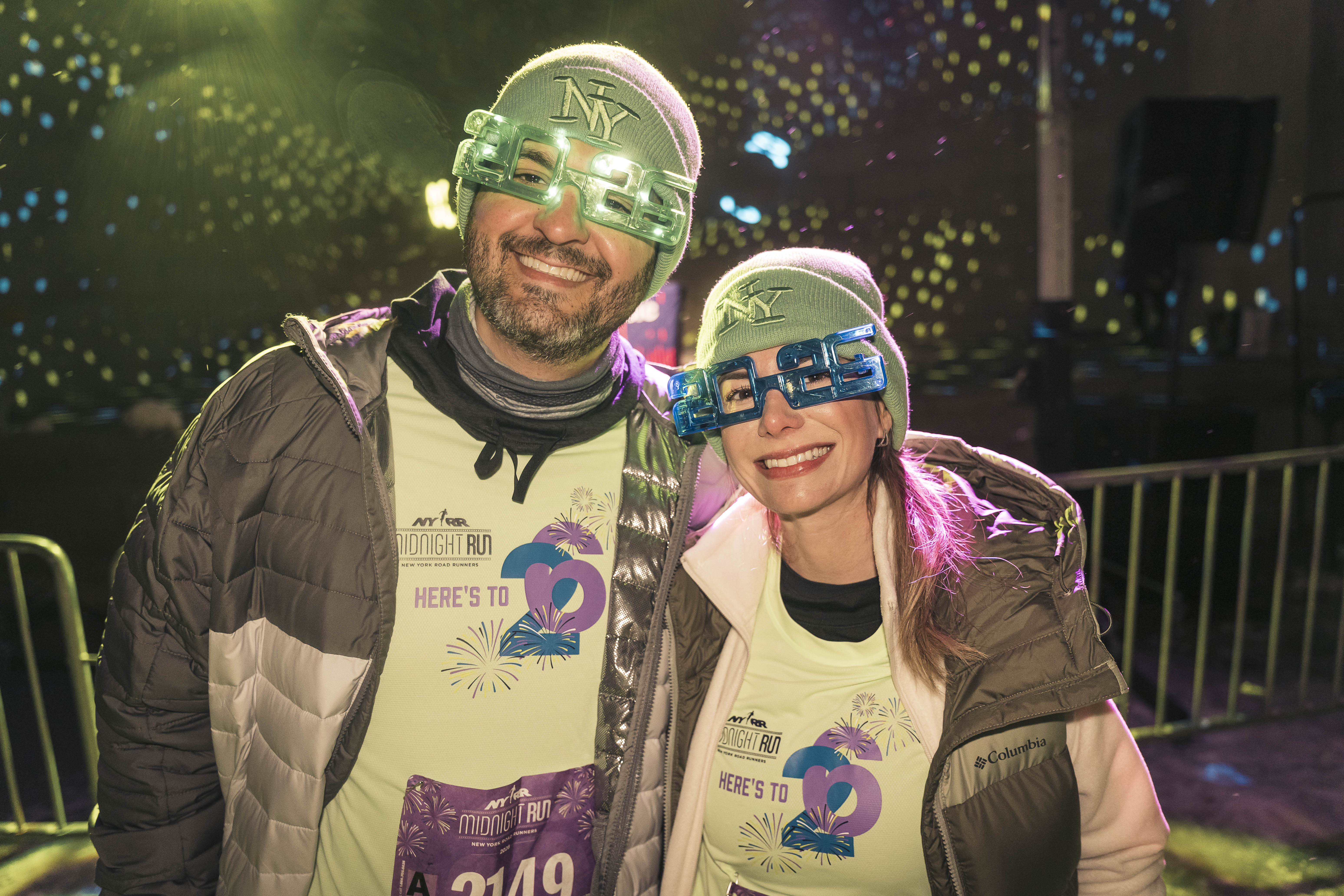 Rafael Vanollil and his wife Derrie Manerich with the Santa Catarina Brazil Runners pose before the NY Road Runners Midnight Run.