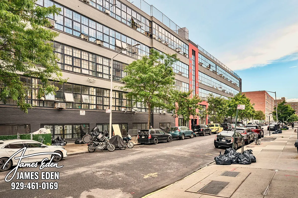 converted building exterior with red band on mckibbin loft signage