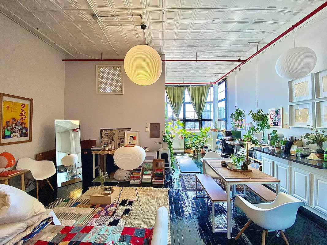 living area with corner windows, tin ceiling