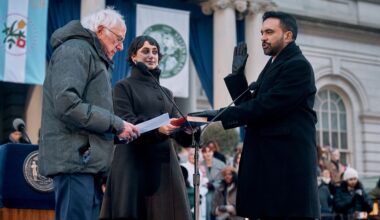 U.S. Sen. Bernie Sanders, I-Vt., left, administers the oath of office to Mayor Zohran Mamdani, right, as Rama Duwaji, center, holds the Quran during Mamdani's inauguration ceremony, Thursday, Jan. 1, 2026, in New York. (AP Photo/Andres Kudacki)