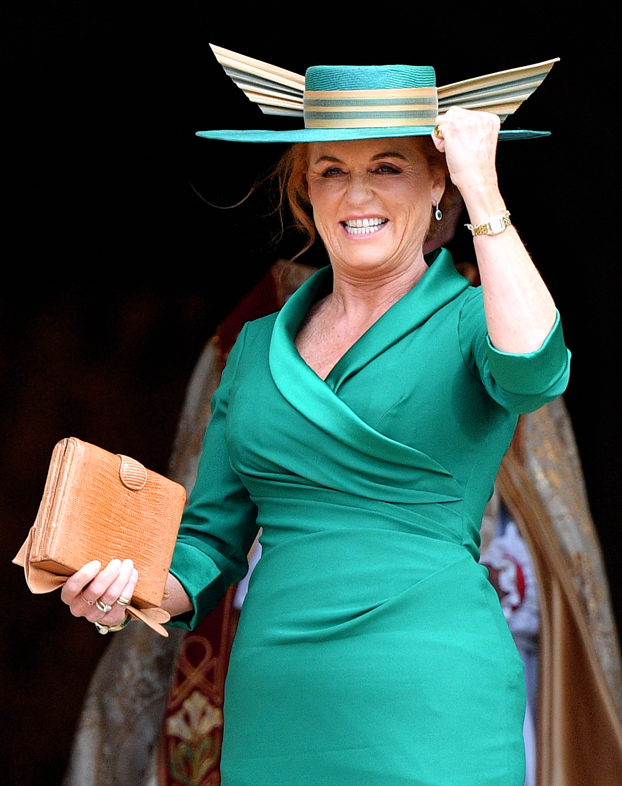 Sarah Ferguson, Duchess of York, smiling in a green dress and hat.