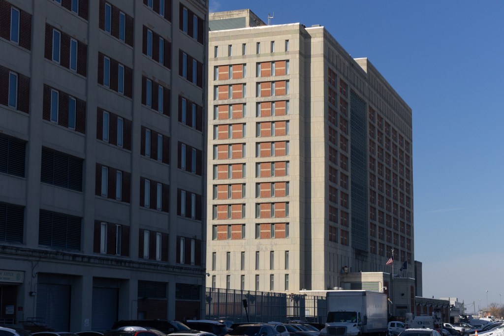 Sun reflects off the concrete federal Metropolitan Detention Center in Brooklyn