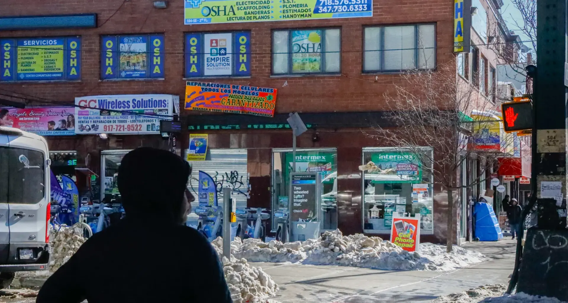 Corona, Queens businesses advertise in Spanish for the large immigrant population in the neighborhood, Jan. 30, 2026. Credit: Alex Krales/THE CITY