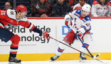 Dec 31, 2025; Washington, District of Columbia, USA; New York Rangers left wing Conor Sheary (43) passes the puck defended by Washington Capitals center Nic Dowd (26) during the first period at Capital One Arena. Mandatory Credit: Hannah Foslien-Imagn Images