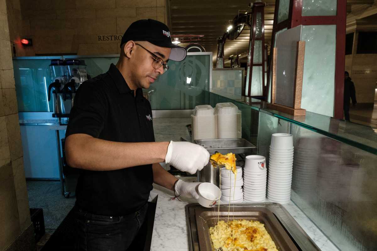 A staff member prepares food at Melba's Grand Central Terminal in the Dining concourse of Grand Central Station in New York City on February 11th, 2025. 