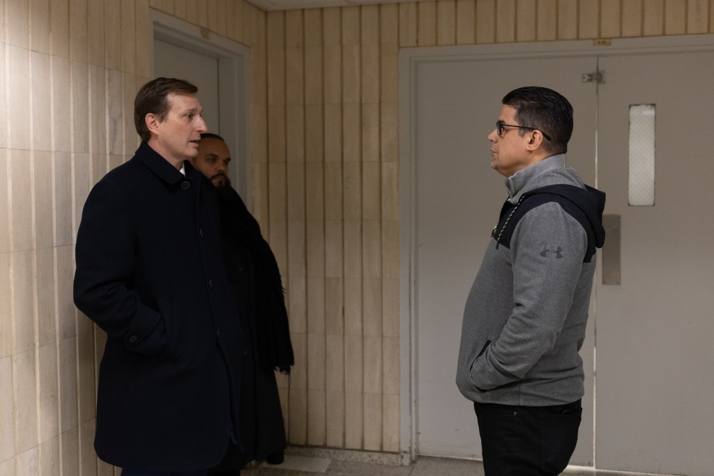 Congressional Rep. Dan Goldman speaks with ICE Assistant Field Officer Alberto Morales about inspecting detention facilities inside 26 Federal Plaza