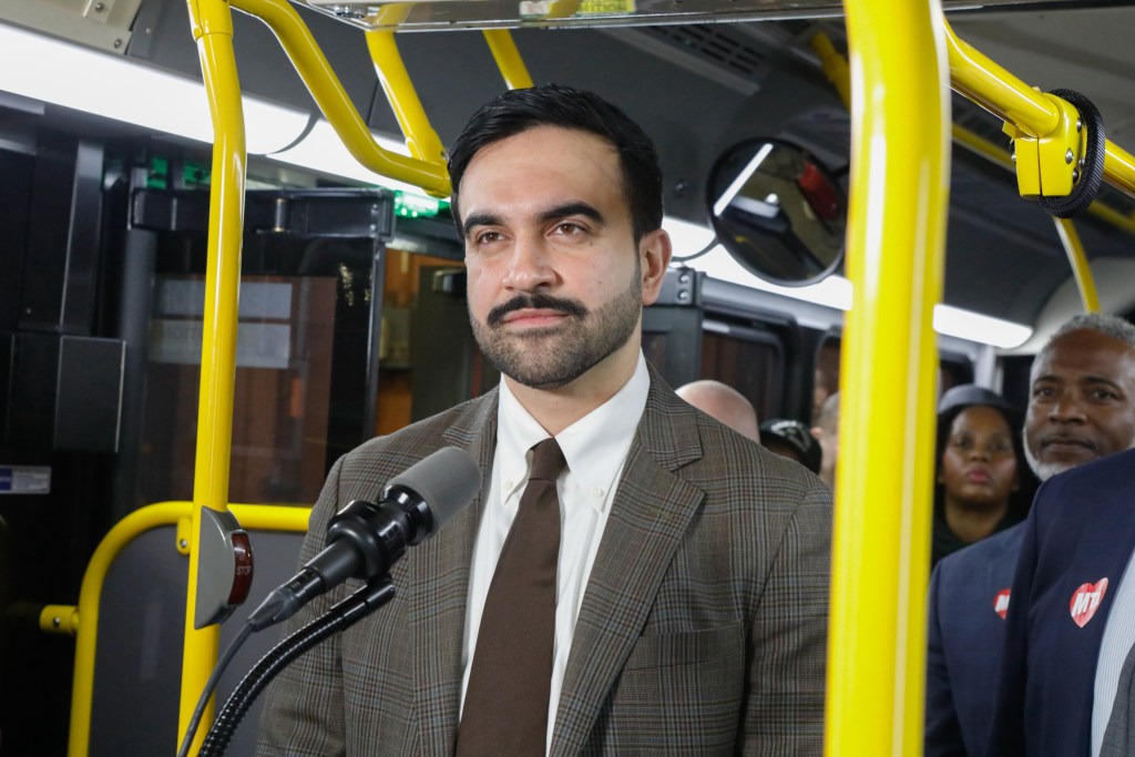 Mayor Zohran Mamdani speaks inside an MTA bus at the West depot in the Bronx about providing free service