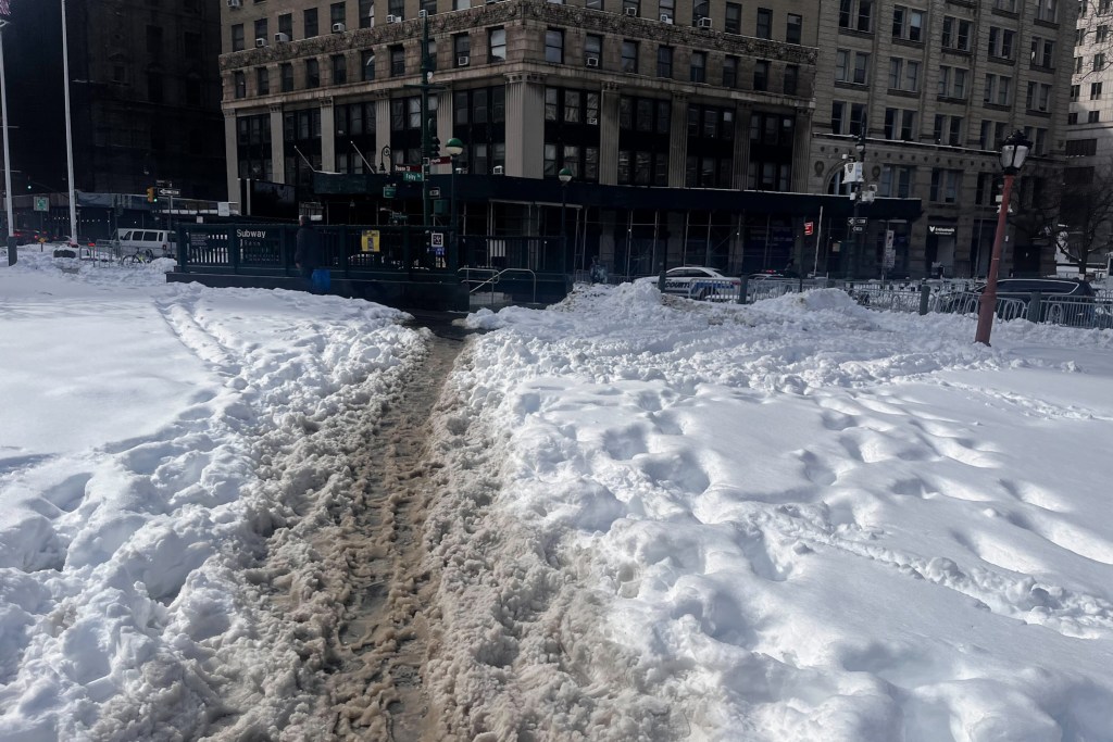 Pedestrian paths in Foley Square were not fully shoveled several days after a blizzard