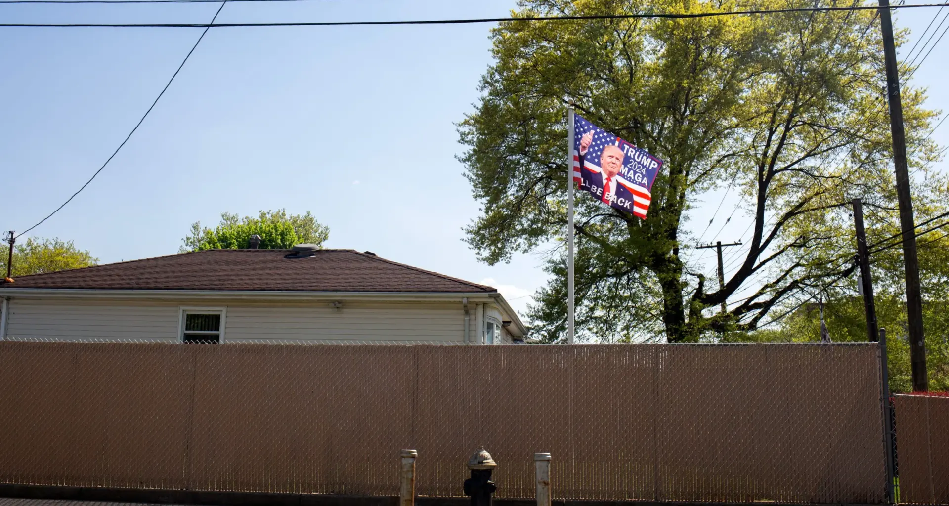 A Staten Island resident in New Dorp Beach flies a pro-Donald Trump flag, May 2, 2024. Credit: Ben Fractenberg/THE CITY