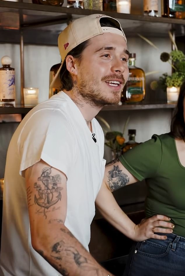 Brooklyn already covered up the tattoo tribute to his father David in another blow (pictured: The anchor tattoo with the word 'dad' running through it before it was covered up)